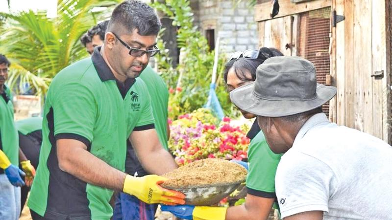 Board Chairman of Habitat for Humanity Sri Lanka - Mr.Lakshan Madurasinghe and members of the HFHSL National Board of Directors volunteering to construct homes for families in Muthurajawela