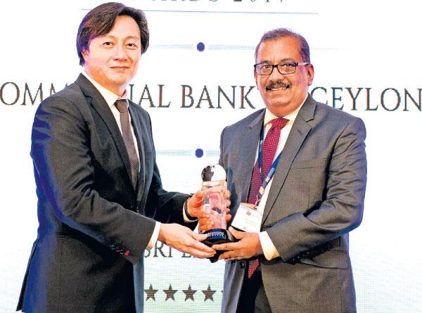 CCO Selva Rajasooriyar (right) receives one of the two awards presented to Commercial Bank by International Finance.   