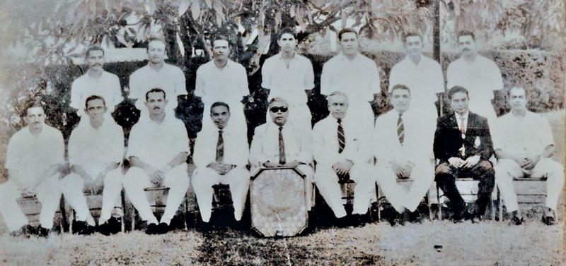 Standing from lef: F.A. Fernando, A.T. Fonseka,V. Narendra, M. Guneratne, F. Burke, M. Siriwardene D. Rajaratnam (seated from left) H.C. Perera, N. Weerasinghe, F. Perumal, B.A. Jayasinghe (President GSCA) Minister of Health E.L. SenanayakeE. L. Abeygunewardene (IGP), T.B. Werapitiya, S. Kuruppu (Secretary GSCA), D. Weerasinghe, T.B. Kehelgamuwa
