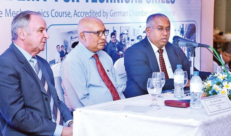  PIC: VIPULA AMARASINGHE      From left: General Manager Technical Competency Development – DIMO Automobile Training School (DATS) Jobst Ferber, Chairman and Managing Director – DIMO Ranjith Pandithage and Group CEO – DIMO Gahanath Pandithage at the lanuch .