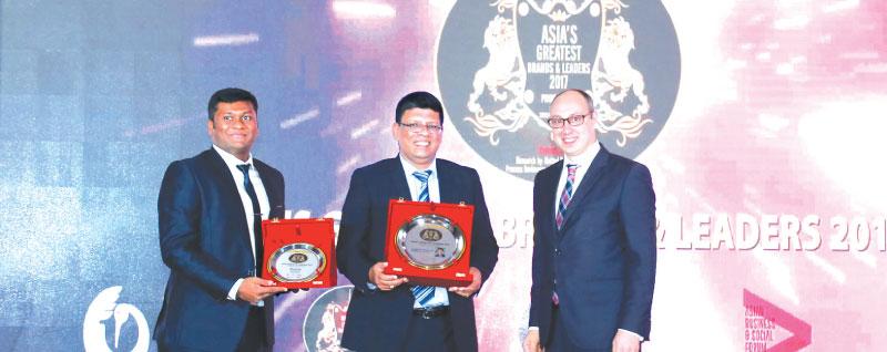 From left: Head of IT and Brand, Blue Ocean, K. Nimeshanan, Group  Chairman, Blue Ocean, S. Thumilan and Ambassador Extraordinary and Plenipotentiary of Ukraine in Singapore, Dmytro Senik at  the awards ceremony.   