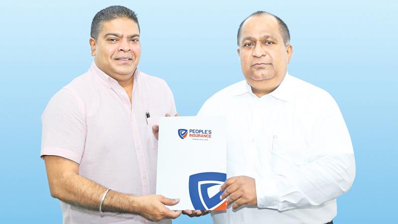 Mobitel Chief Executive Officer Nalin Perera exchanges the partnership agreement with People’s Insurance Chief Executive Officer Deepal Abeysekara.