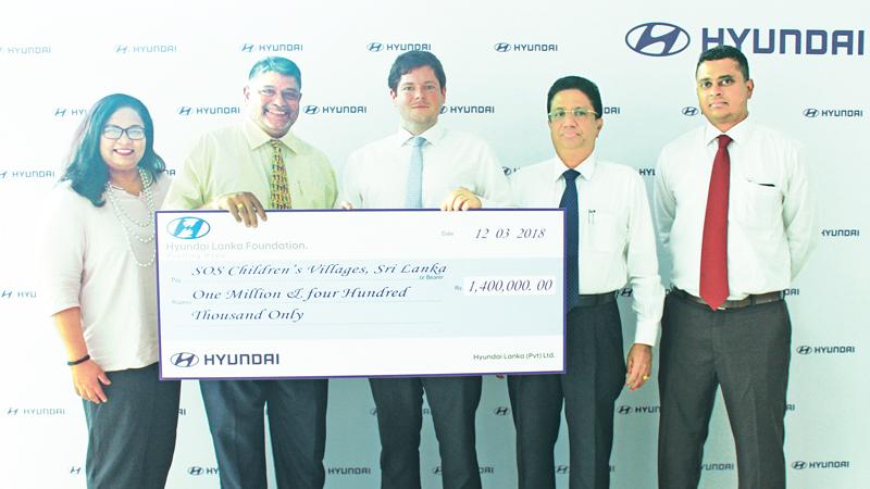 Julian Reuter –Director of Hyundai Lanka donating the cheque to Divakar Ratnadurai - National Director at SOS Children’s Villages Sri Lanka, Flanked by SujithPieris - Director – Strategic Business Development and Sirhan Fernando, Head of Marketing at Hyundai Lanka (Right) and Hasangika Fernando Assistant Director Fund Development & Communications at SOS Children’s Villages Sri Lanka (Left) 