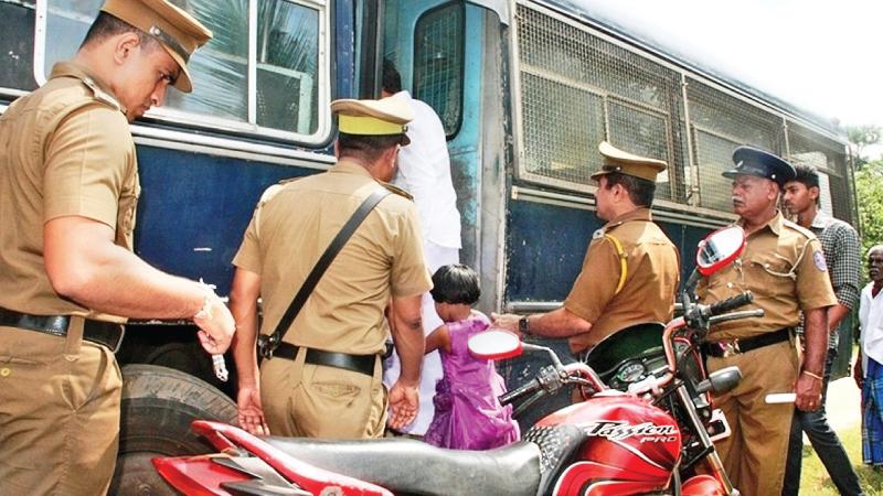 Sangeetha tries to board the prison bus, by force
