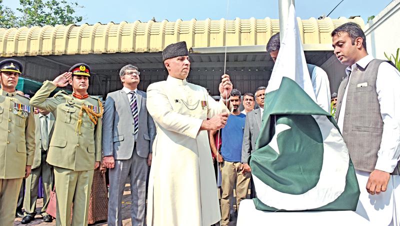 Acting High Commissioner of Pakistan hoists the Pakistan national flag. Pic by Chaminda Niroshan