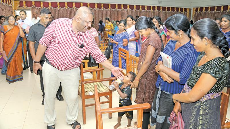 Minister Mangala Samaraweera met women’s groups at the Puthukudiyirippu Divisional Secretariat yesterday