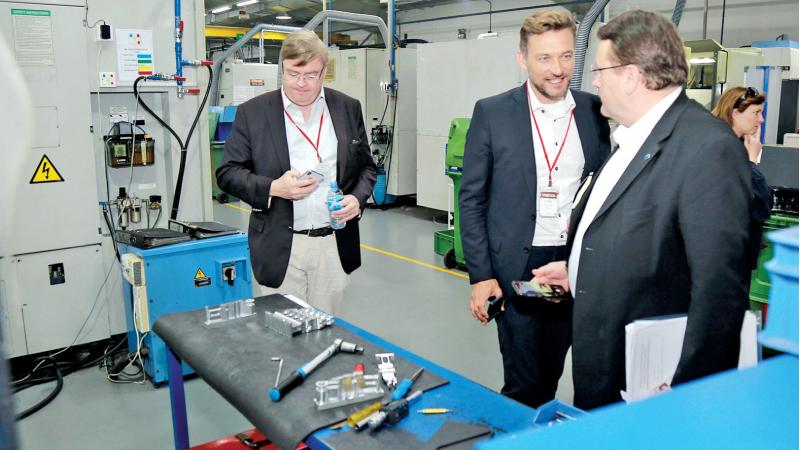Members of the EU Parliamentary delegation at a factory