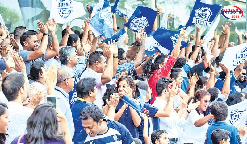 Fans of St. Joseph’s College cheer their team against Royal College last week at Havelock Park.  Pic courtesy: papare.com
