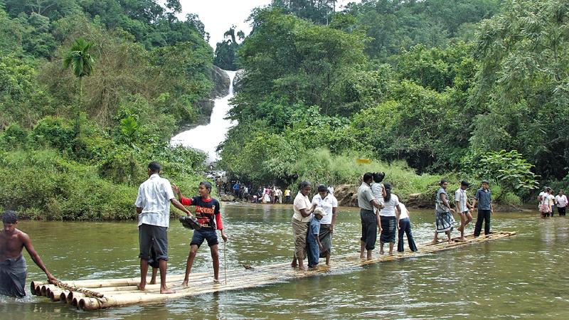  NATURE’S WONDER: A magnificent Bopath Ella waterfall with bamboo boat