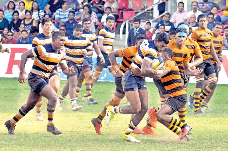 Peterite Rukshan Madushanka slams through the DS Senanayake defence 