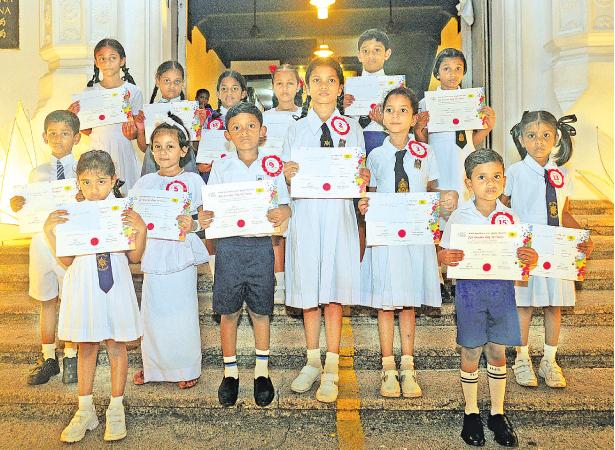 Winners in the 1st Category: Red Batch (Grade 1 to 5) of the All Island Art Competition conducted under the auspices of the YMBA, Colombo at the Lake House Amadahara Vesak Zone last week. Winners who received their prizes:    Front row from left - Senuri Dinethma Jayaratne (Musaeus Colleg e- Colombo) S.A.M. Hiruna Sadilka - Mayurapada K.V.    Second row from left - M.P. Rasanjana Vibhuthi Rajapaksha NK/Wa/Sanghabodhi M.M.V. Avulegama, W.V.D. Dulani Onadi Vithanage - Sri Devananda Dhamma School, H.M. Kalindu