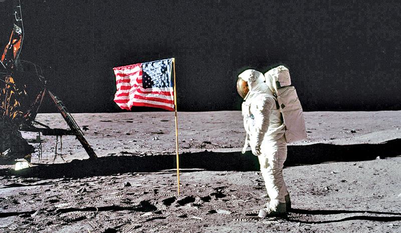 Neil Armstrong and the US flag.