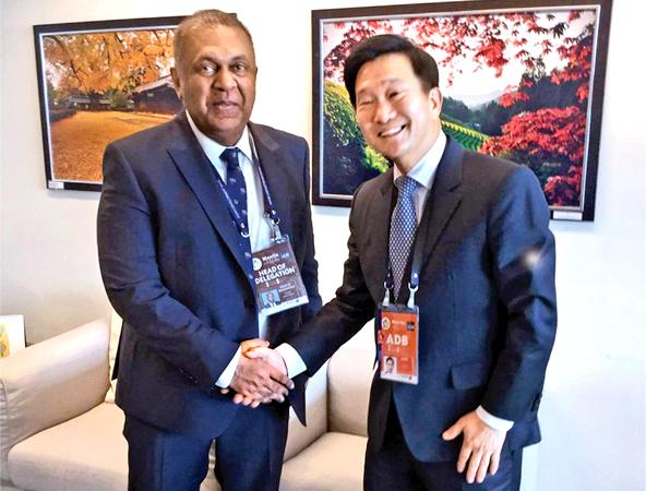 Minister Mangala Samaraweera with ADB Executive Director In-Chang Song.