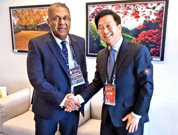  Minister Mangala Samaraweera with ADB Executive Director In-Chang Song.    