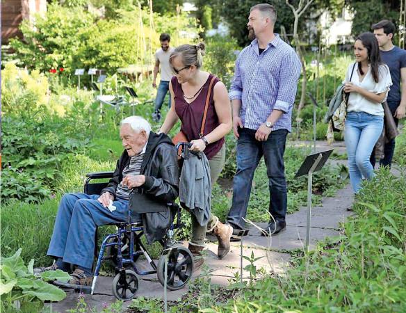 Making the most of it: David Goodall tours the Basel University Botanical Gardens with three of his grandchildren and two of their partners the day before his planned assisted suicide  
