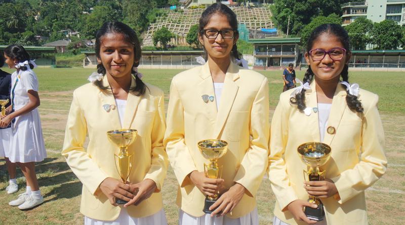 Captains of the netball champions of Hillwood College, from left Under-20 captain Thirani Welianga, Under-18 captain Jayathri Wijewardena and Under-16 captain Puthra Devadasan    
