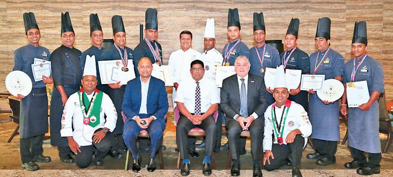 Seen here are the winners of both competitions flanked by (seated L-R) Manesh Fernando, General Manager Hilton Colombo, Krishantha Cooray, Chairman Hotel Developers PLC (Owning Company) and Paul Hutton, VP Operations SEA for Hilton and Kazi Hassan, Executive Chef (standing center).  