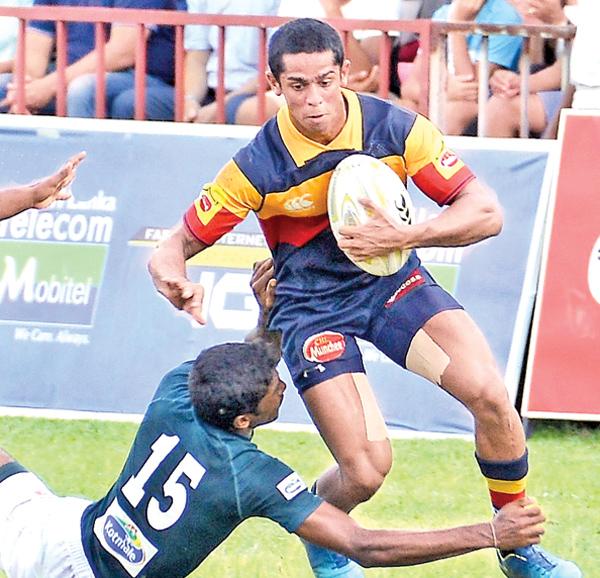 Trinity College player Sakalasuriya makes a break against the Isipathana College defence Pic: Saman Mendis