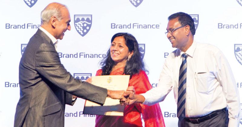 Nestlé Managing Director Shivani Hegde and Nestlé Vice President, Corporate Affairs and Communications, Bandula Egodage, receive the Brand Finance Award from Brand Finance Managing Director,  Ruchi Gunewardene.   