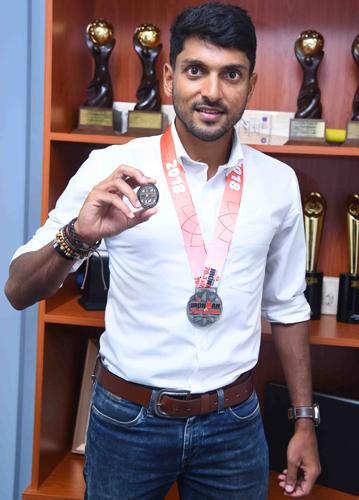  Mithunwith his winning medals.  