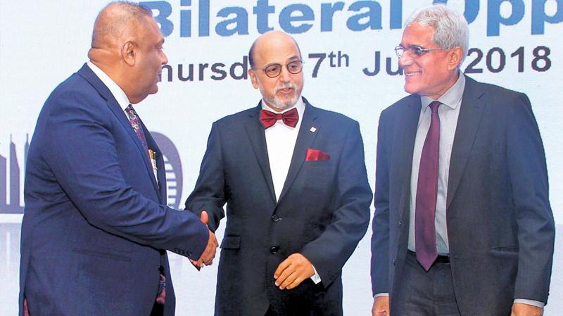 Chief Executive Officer of Doha Bank, Dr. R. Seetharaman with Finance Minister Mangala Samaraweera, and Central Bank Governor, Dr. Indrajith Coomaraswamy at a reception held at the Shangri La Hotel Colombo to mark the opening of Doha Bank Colombo on Thursday. Pic: Sulochana Gamage