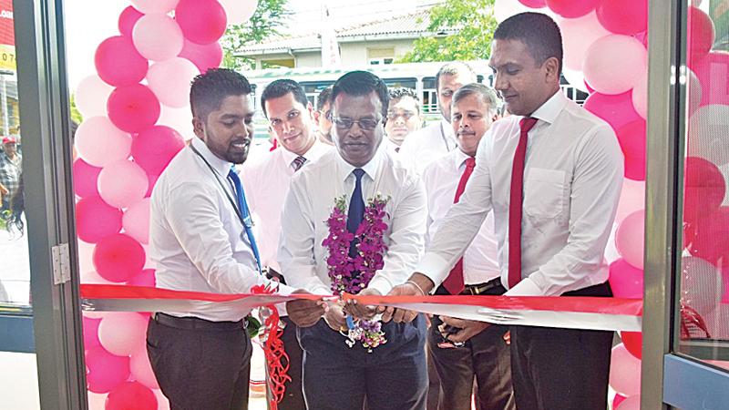 Sumudu Rodrigo - Officer in charge - Puttalam is seen on the left, with Mayura Fernando - CEO and Nilantha Jayanetti,  Senior Assistant General Manager- Marketing, at the ceremonial opening of the Customer Service Centre, Puttalam.