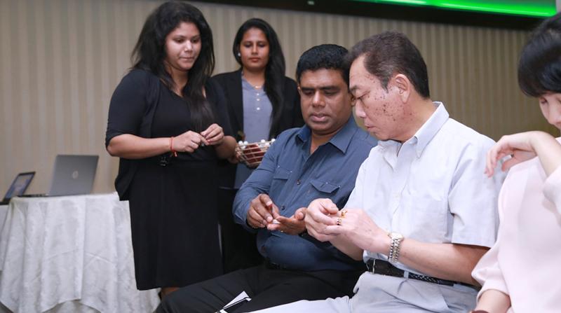 Invitees experience the Eco Balm range of products. Pic: Chaminda Niroshana    