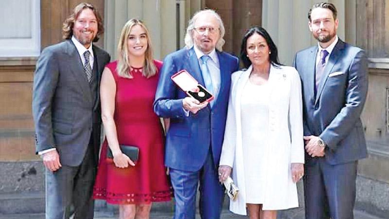 Proud moments: The star was surrounded by his family at the ceremony