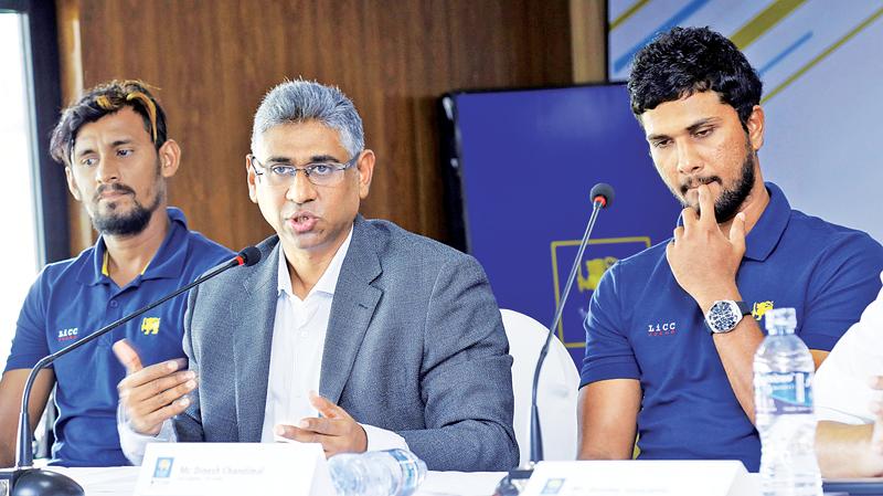 Dinesh Chandimal (right) reacts on his return from the West Indies along with Sports Minister Faizer Mushtapha and vice captain Suranga Lakmal Pic: Chinthaka Kumarasinghe