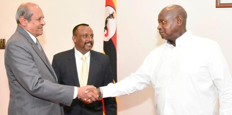 Minister of Foreign Affairs Tilak Marapana and Ugandan President Yoweri Kaguta Museveni greet each other
