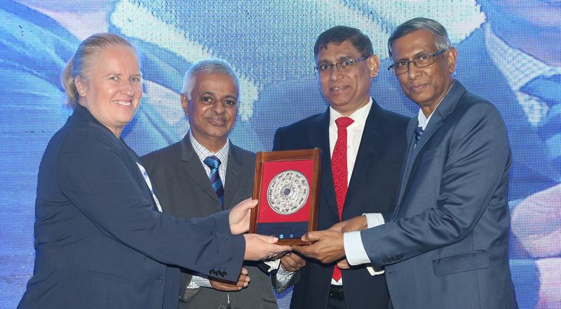 Jagath Perera, Prof. Lakshman R. Watawala and Jazri Magdon Ismail present a token of appreciation to IFAC President Rachel Grimes. 