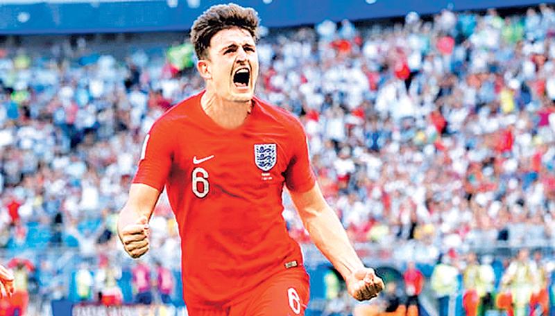 England’s Harry Maguire  celebrates scoring his team’s first goal in the quarter final against Sweden    