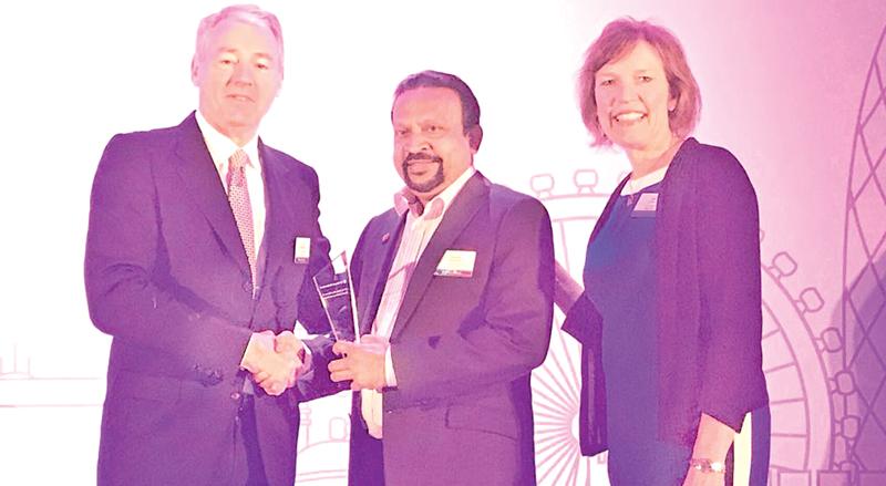 A DMS official receives the award from the Senior Vice President and Managing Director of Entrust Datacard in London.  