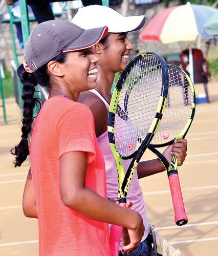 Anika (in white cap) and Alana Seneviratne after their win