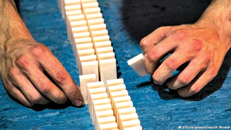 A German domino team was attempting to break a record for miniature dominoes. But a fly triggered a premature chain reaction.  