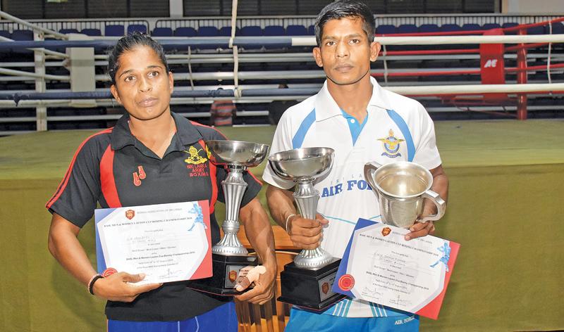 Chandrika (left) and Kumara with their trophies