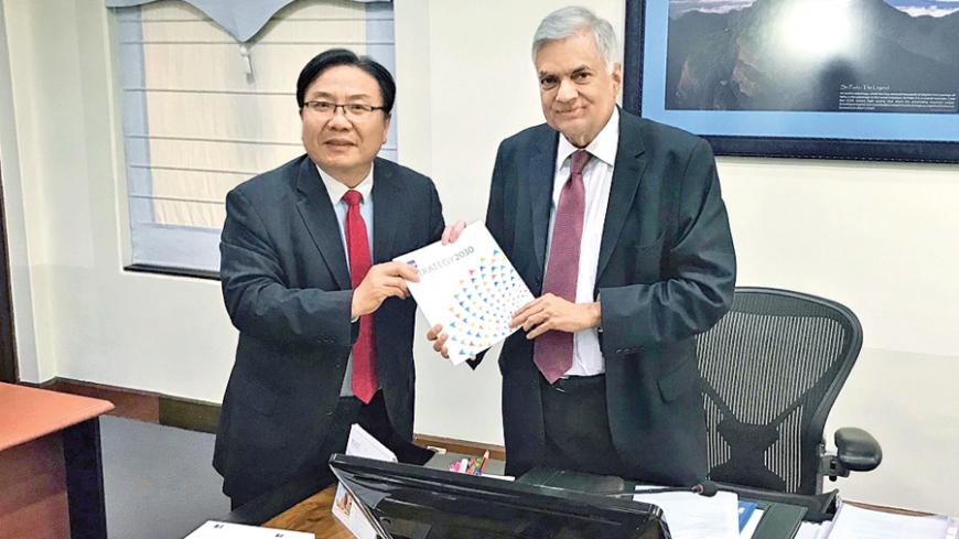 ADB Vice President Wencai Zhang presents a copy of ADB’s new strategy, ‘Strategy 2030’ to Prime Minister Ranil Wickremesinghe. 