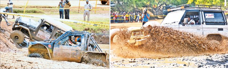 Two competitors attempt to extricate from a mud ditch in the Extreme Class Jeeps event  -Gayan Lakshan competing in the Touring Class Jeeps 3000cc goes through a mud filled area  