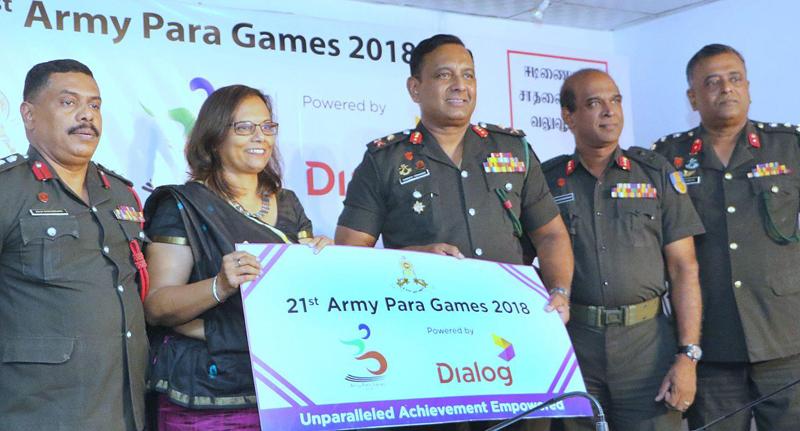 Chief Marketing Officer of Dialog Amali Nanyakkara hands over the sponsorship check to President of Army Para Sports Committee Chief of Staff Major General W.B.D.P. Fernando. Picture by Saman Sri Wedage   