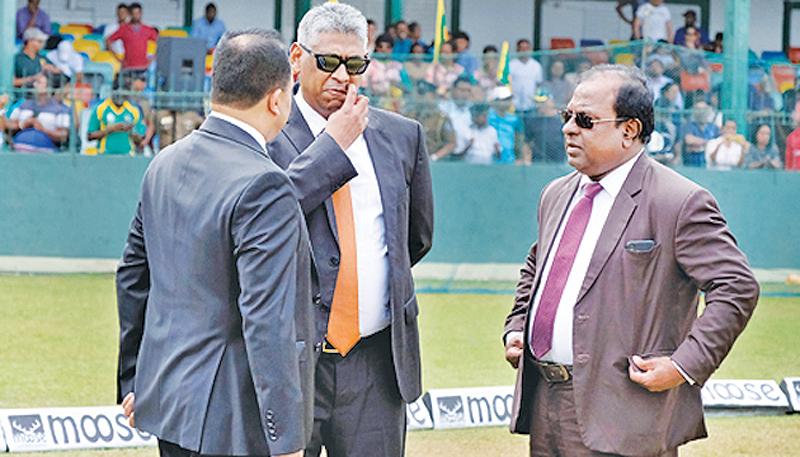 Nero was fiddling while Rome was burning: File photo of Sports Minister Faiszer Mushtapha (centre) and Competent Authority of SLC Kamal Padmasiri (centre) talking to SLC’s Ashley de Silva before a fruitless meeting with the ICC last month    