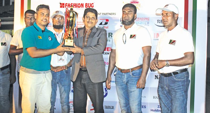 Soccer winners Zahira Veterans captain Jaufer Sadik receiving champion award from Bronze sponsor Genius Engineering Services Senior Manager HDR Janaka. President of the G90 MRM Razak, Project Chairman MTM Milhan and Secretary Shamraz Zuhair were present. Pic Ruzaik Farook