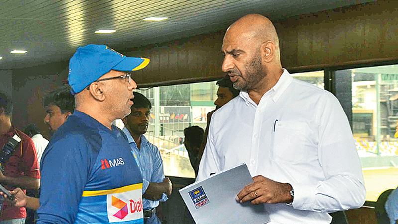 Chief selector Graeme Labrooy (right) drives a point into coach Chandika Hathurusinghe in the aftermath of drastic changes in the Sri Lanka team