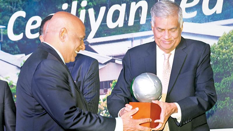 CEO of Ceciliyan Associates, Paani Dias receives the award from Prime Minister Ranil Wickremesinghe.   