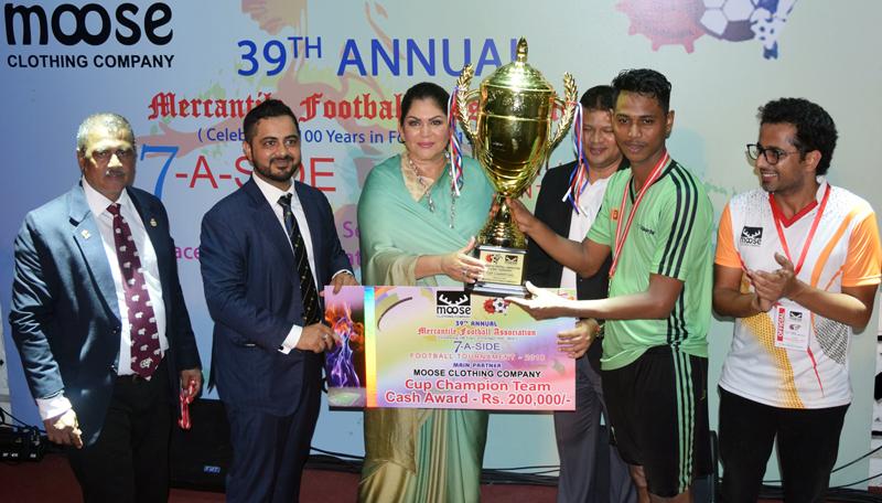 Captain of the Expolanka football team M Shazny receives the Cup from Colombo Mayor Rosy Senanayake after his team emerged champs at the 39th Mercantile Football Sevens tournament that also commemorated 100 years of the sport in Sri Lanka  Picture by Sudath Nishantha