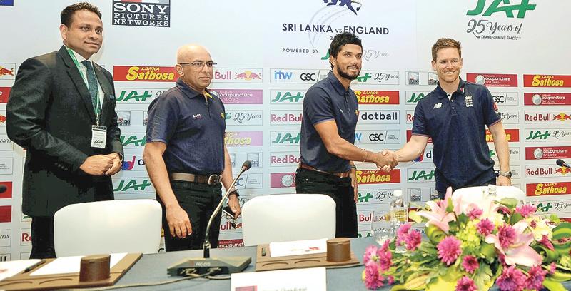 Sri Lankan captain Dinesh Chandimal and his England counterpart Eoin Morgan shake hands at the launch of the series   (Picture by Herbert Perera)     