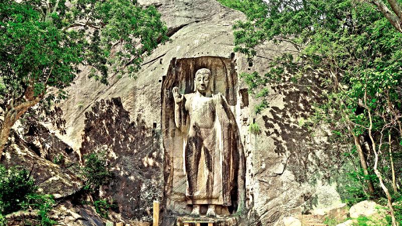 ELOQUENCE IN STONE: The magnificent Sasseruwa Buddha carved out of a single rock rises to a height of over 42 ft.