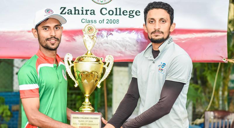 Strange Giants team captain Mohamed Usman receiving the champion award from Class of 2008 president Bilal Miskin