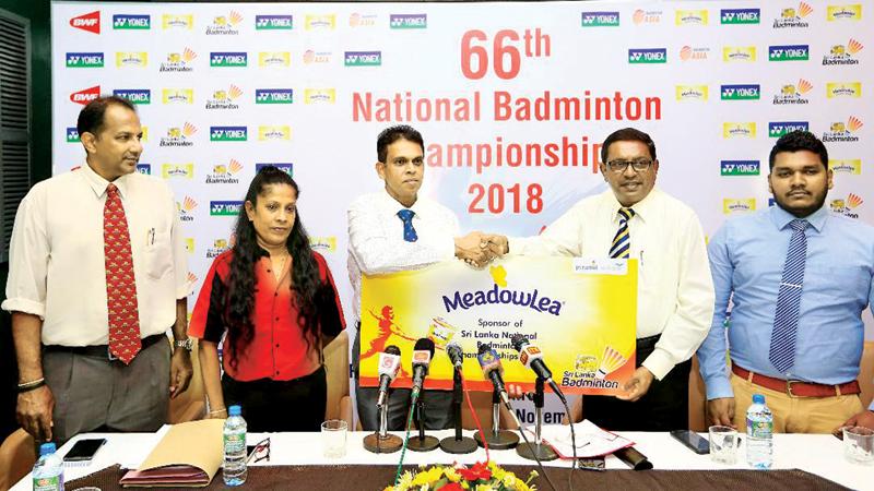 Hiranth Fernando (R) head of Sales and Marketing (Meadowlea) Pyramid Wilmar presents Sri Lanka Badminton president Nishantha Jayasinghe with a sponsorship payment in connection with the National Championships at a media briefing held at the SSC boardroom in Colombo