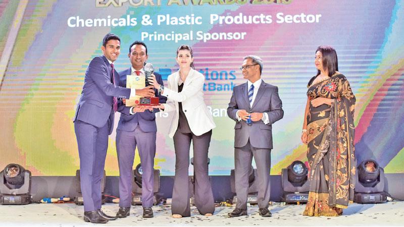 Macksons Chief Operating Officer, Ismail Hussain receives the award  
