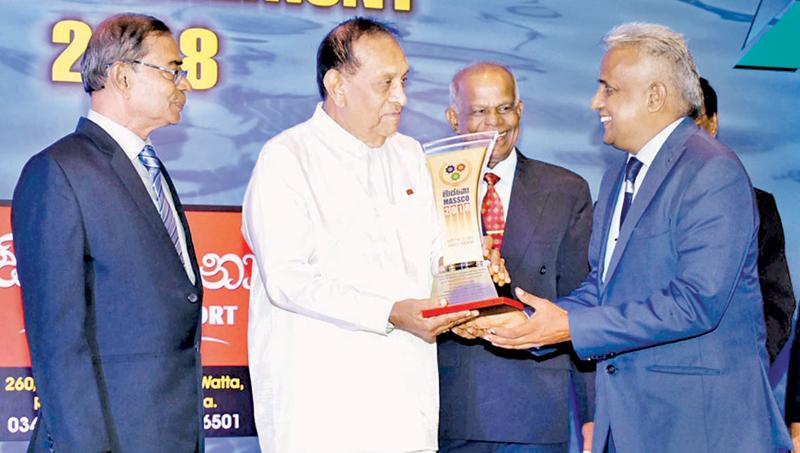 Picture shows Managing Director, M. Selvaraja receiving the MASSCO Award from the Speaker. 